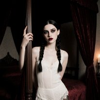 Atmospheric scene inspired by gothic aesthetics and mystery Darkness flows softly through spaces of stone and memory. Fine haze gathers in flickering light as time loses weight. Between patina and grace unfolds a quiet...