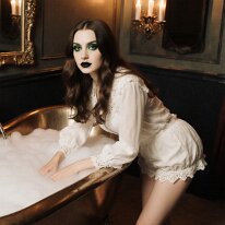 Atmospheric scene inspired by gothic aesthetics and mystery Candlelight dances across stone and shadow, revealing gothic elegance and subtle longing. Faces emerge from half-light, distant yet intimate, hinting at untold...